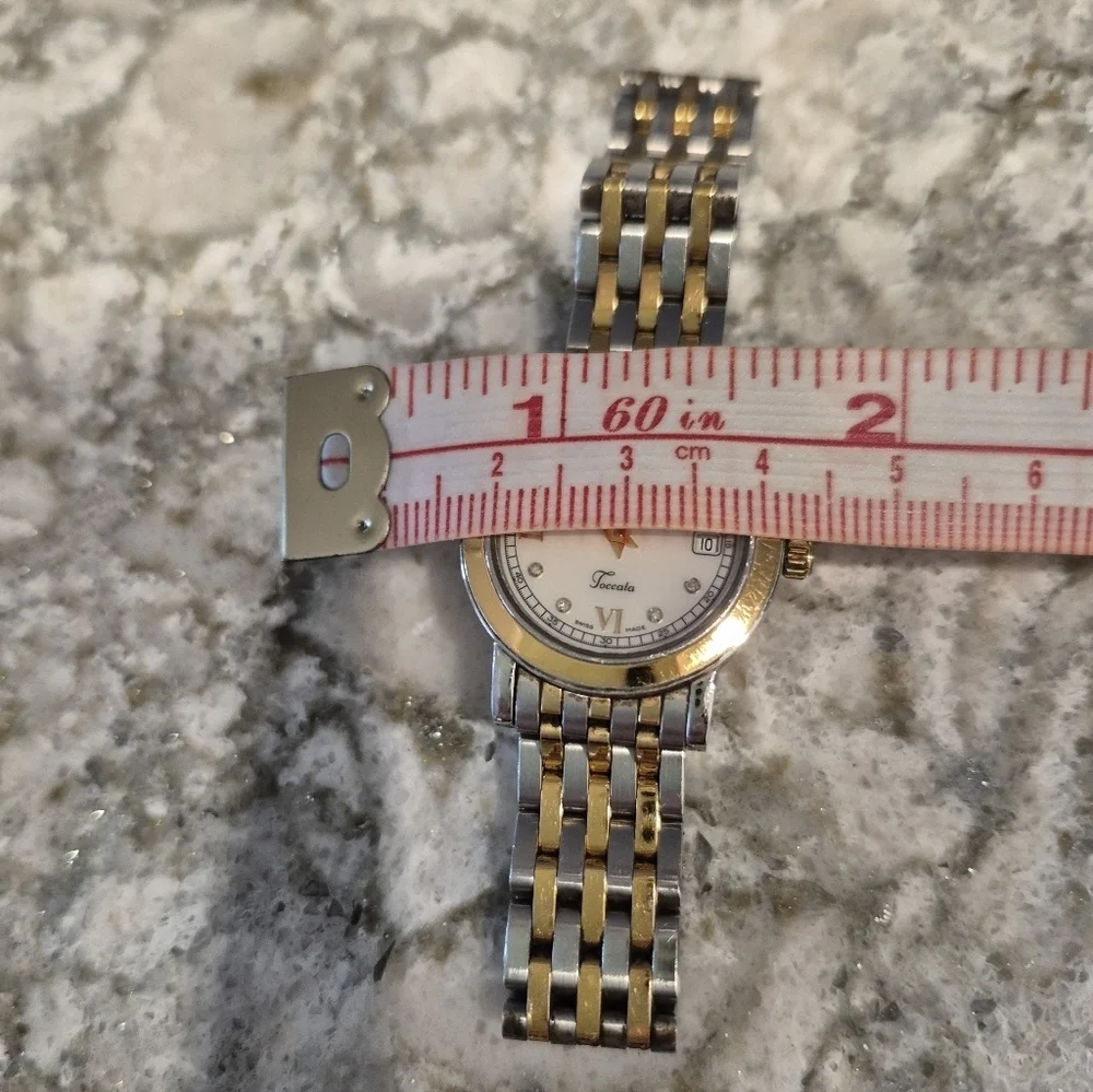 Raymond  Weil Toccata woman's watch with pearl face and Diamond accents.